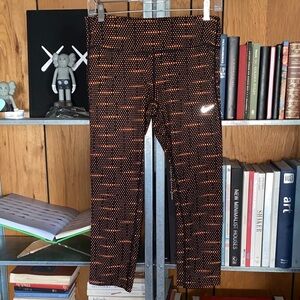 NIKE RUNNING Dri Fit Epic Cropped Leggings Black/Orange